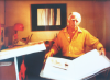 Photograph of Harry Ousey (1915 -1985) in his house in France, photograph, 15 x 23 cms. Presented by Susan and Ronald Astles in 2004.