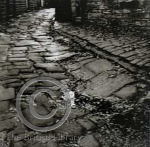 Godwin, Fay (1931-2005): Paved path above Lumbutts, 1977 from the series The Remains of Elmet, printer: Stoneman, Hugh (1947-2005), publisher: Zwemmersand Print Centre Publications, signed, photogravure published by Faber (number 6 of an edition of 30) published 1994, 34.2 x 33.2 cms. The Art Fund Hugh Stoneman Archive. (c) The British Library Board.