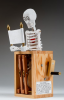 Smith, Matt: The Secret, signed and dated 2013, inscribed The Secret: Whilst perusing the latest designs, this skeleton checks for rivals who might wish to steal his secret, thus denying him the pleasure of causing mayhem and disorder when the carefully guarded confidence is revealed., automaton, 25 cms high.